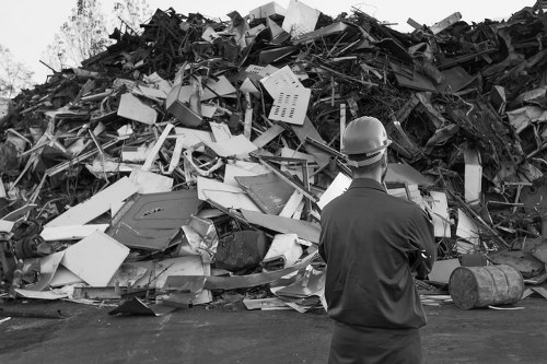 Rubbish removal team handling waste collection paperwork